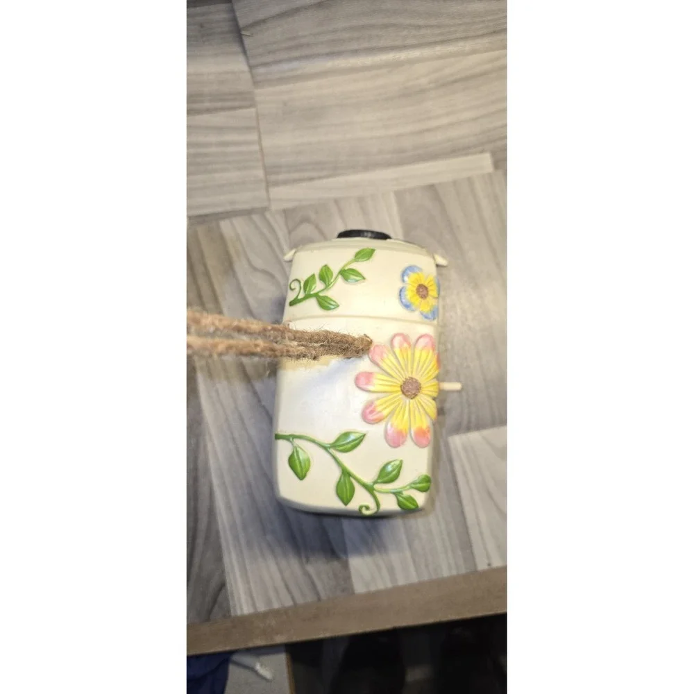 decorative birdhouse styled like a vintage camper van